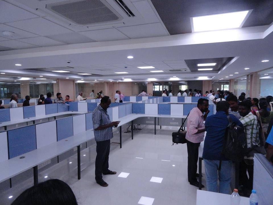 Team members at work on a TiliconVeli office floor